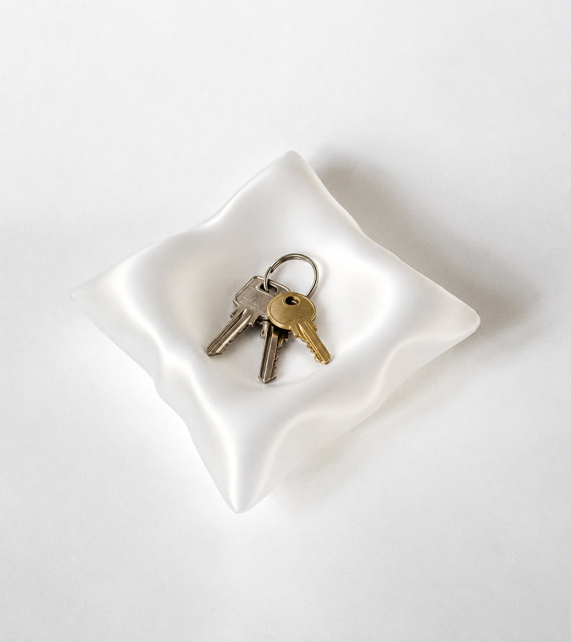 Kissendesign mit Ablageschälchen